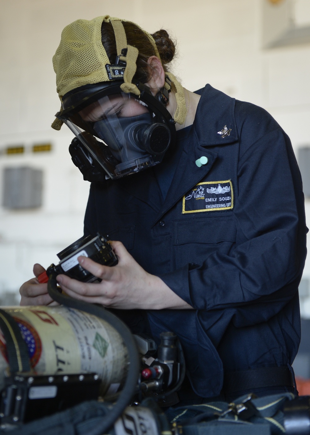 Sailor conducts SCBA inspection