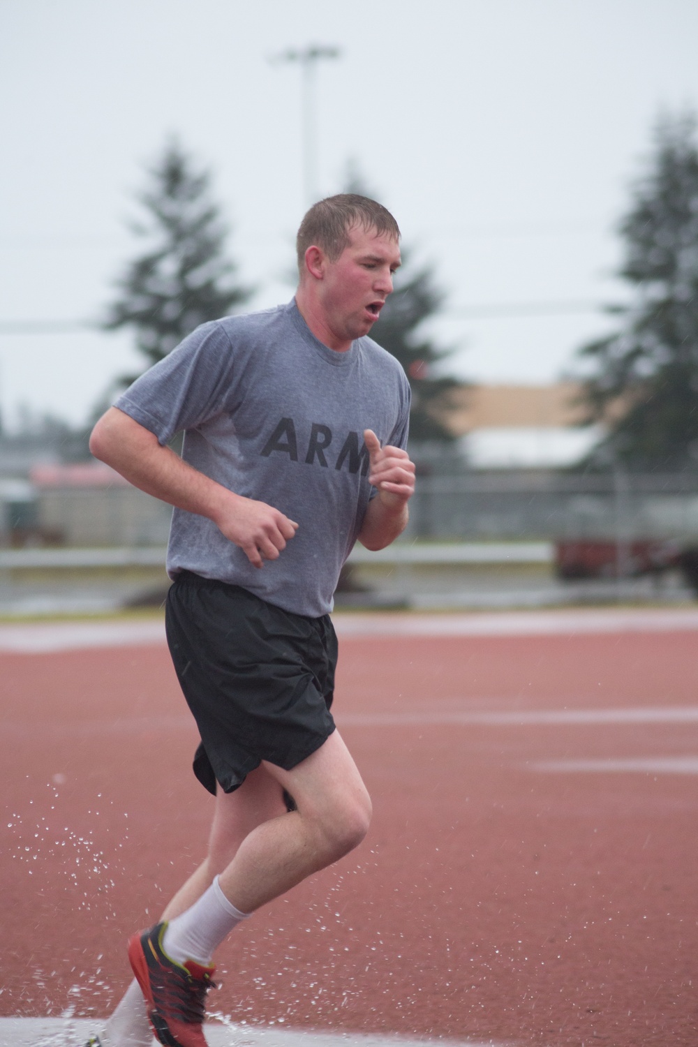 Spc. Christopher R. Williams races towards the finish line of the 2-mile run portion of the Army Physical Fitness Test, during the 301st Maneuver Enhancement Brigade Best Warrior Competition