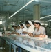 Plant workers at Woodward Factory in Karachi