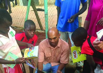 Fort Lee Soldier, organizations donate books to Ugandan orphanage