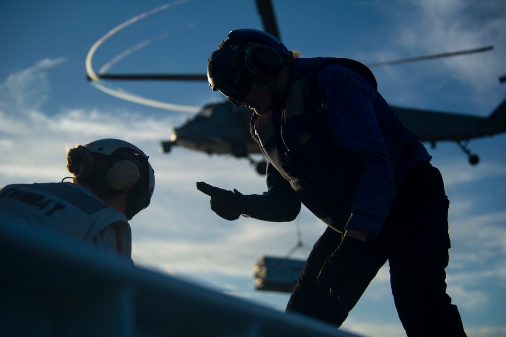 USS America conducts ammunition on-load.