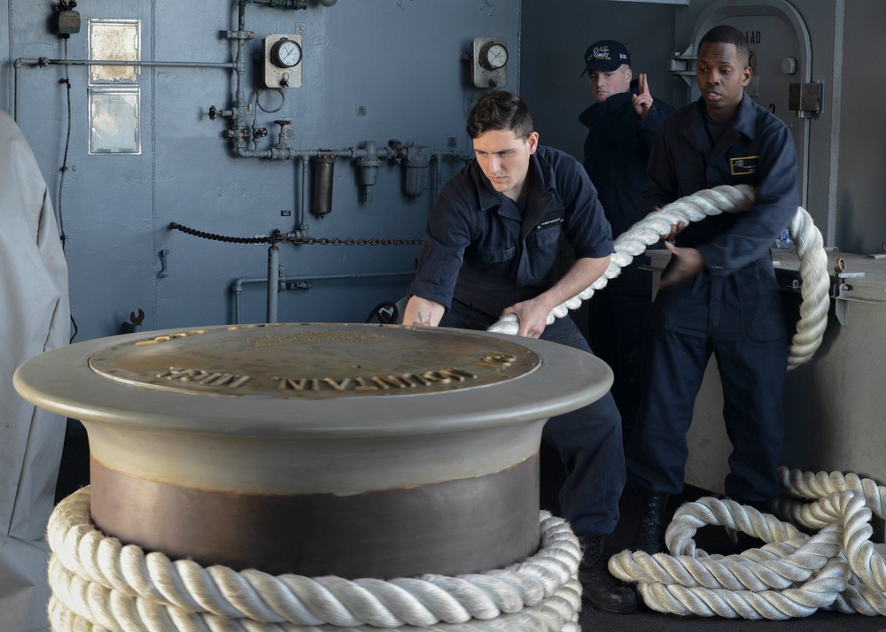 Sailors linehandling on board USS Nimitz