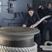 Sailors linehandling on board USS Nimitz
