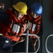 Sailor shouts orders to linehandlers