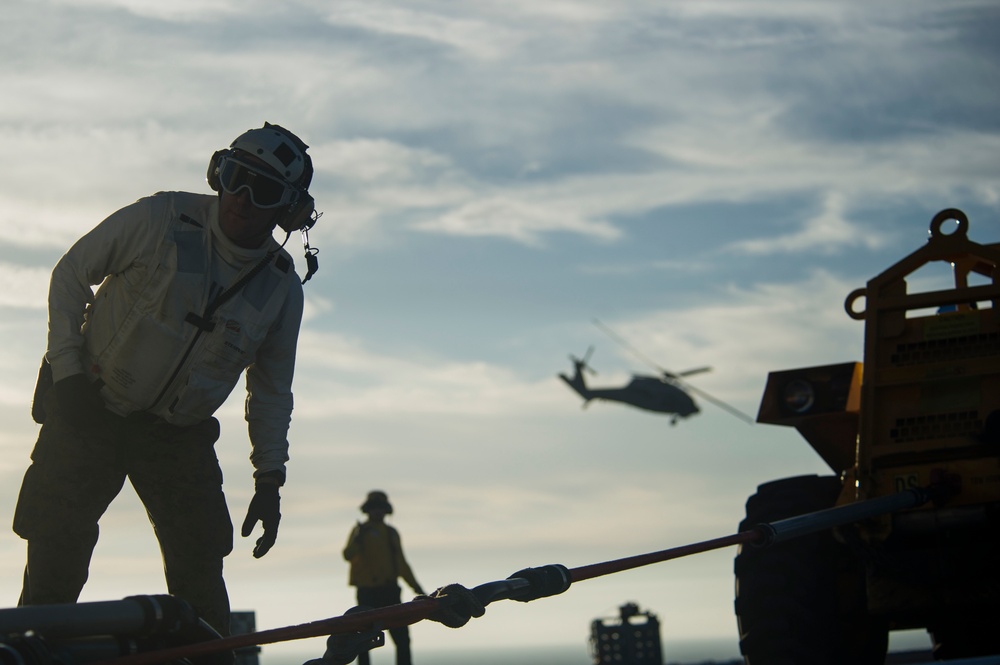 USS America conducts ammunition on-load.