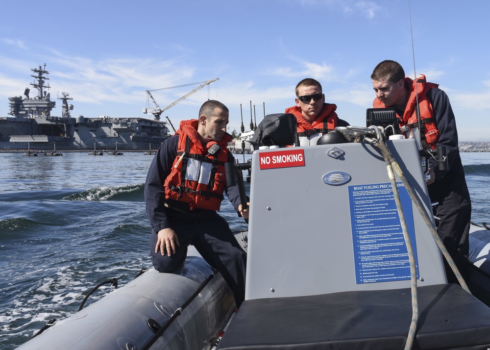 Sailors operate RHIB
