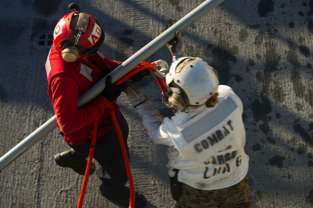 USS America conducts ammunition on-load.