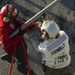 USS America conducts ammunition on-load.