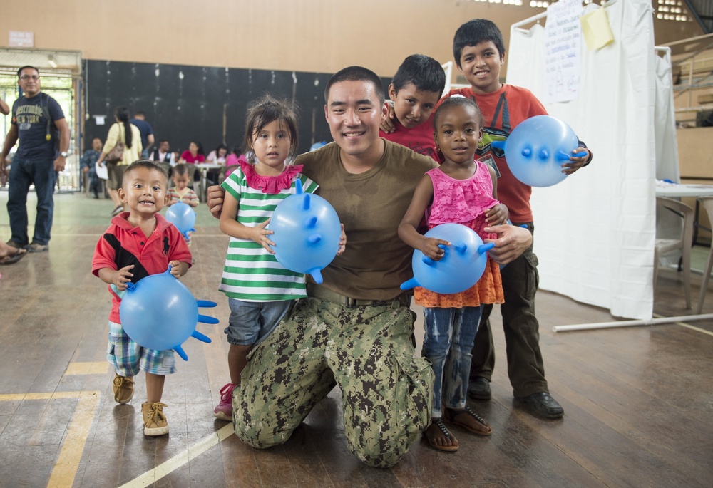Lt. Andy Wang Poses for a Photo with Host Nation Patients at the Continuing Promise 2017(CP-17) Medical Site