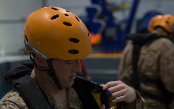 U.S. Marines practice water survival skills with Spanish allies