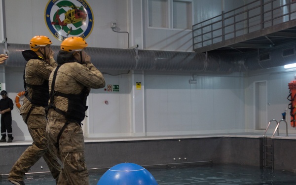 U.S. Marines practice water survival skills with Spanish allies