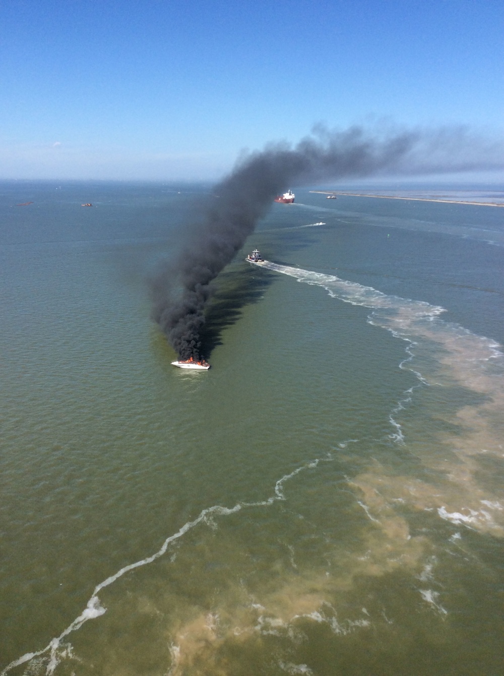 Coast Guard rescues 2 from burning boat