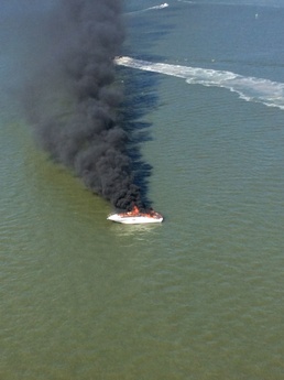 Coast Guard rescues 2 from burning boat
