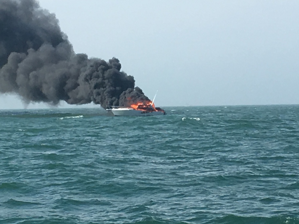Fishing boat burns after Coast Guard rescues 4