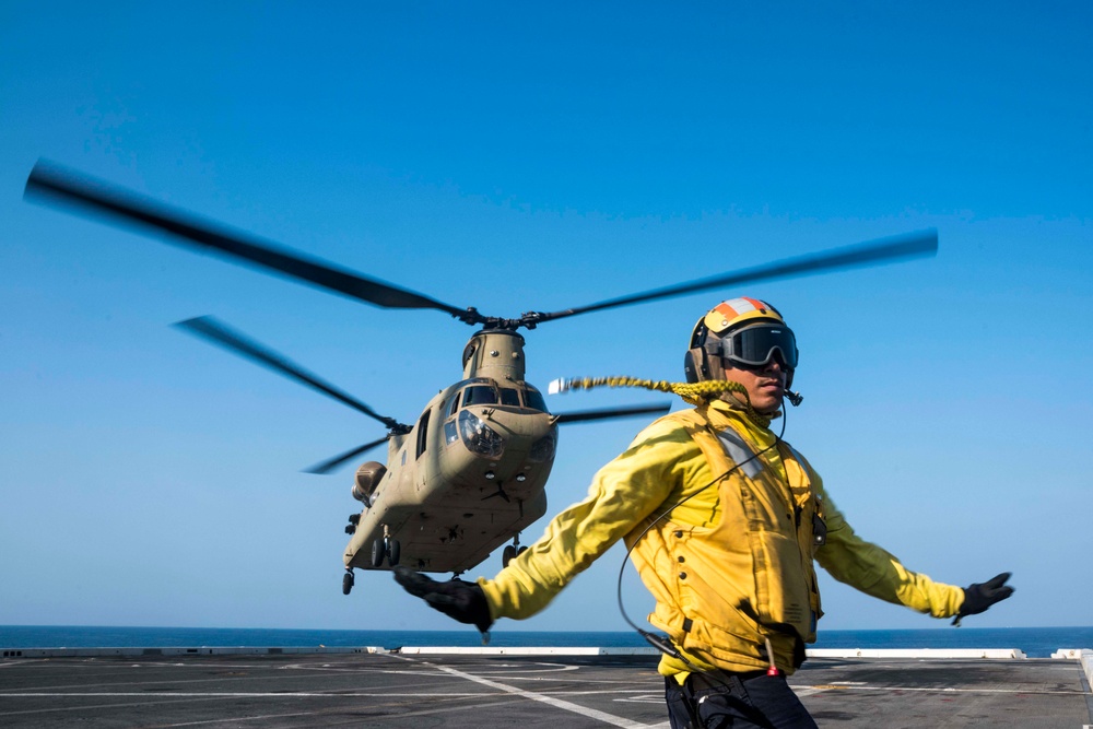 U.S. Army and Navy work together to land Army helicopters on USS Green Bay’s flight deck during Cobra Gold