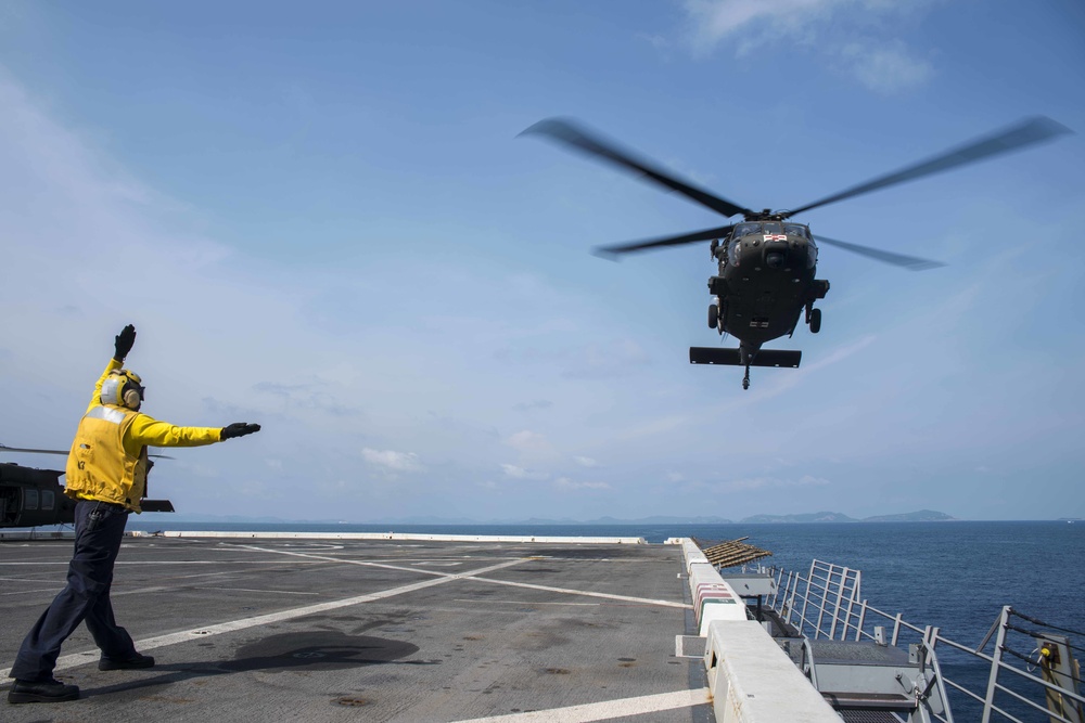 U.S. Army lands helicopters on USS Green Bay’s flight deck during Cobra Gold