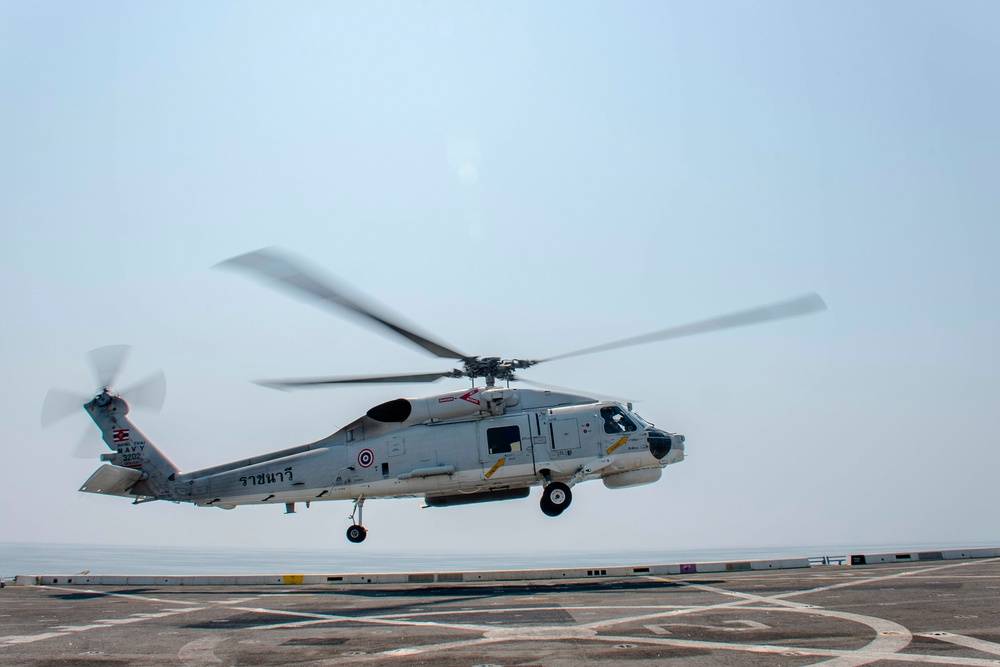 Royal Thai Navy helicopter conducts deck landing qualifications on the fligh deck of USS Green Bay