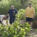 PMT det Guam Sailors Clear Brush Along Marbo Cave Access Road Feb. 17