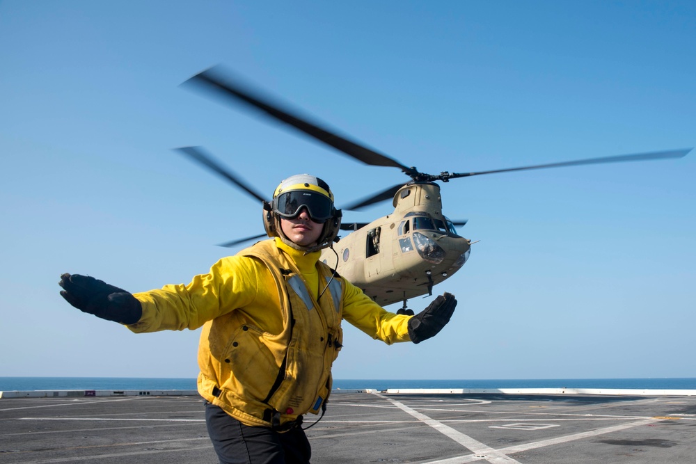 U.S. Army and Navy work together to land Army helicopters on USS Green Bay’s flight deck during Cobra Gold