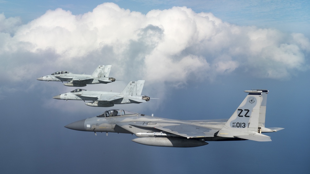 44th FS flies with Navy VFA-27 and VFA-102