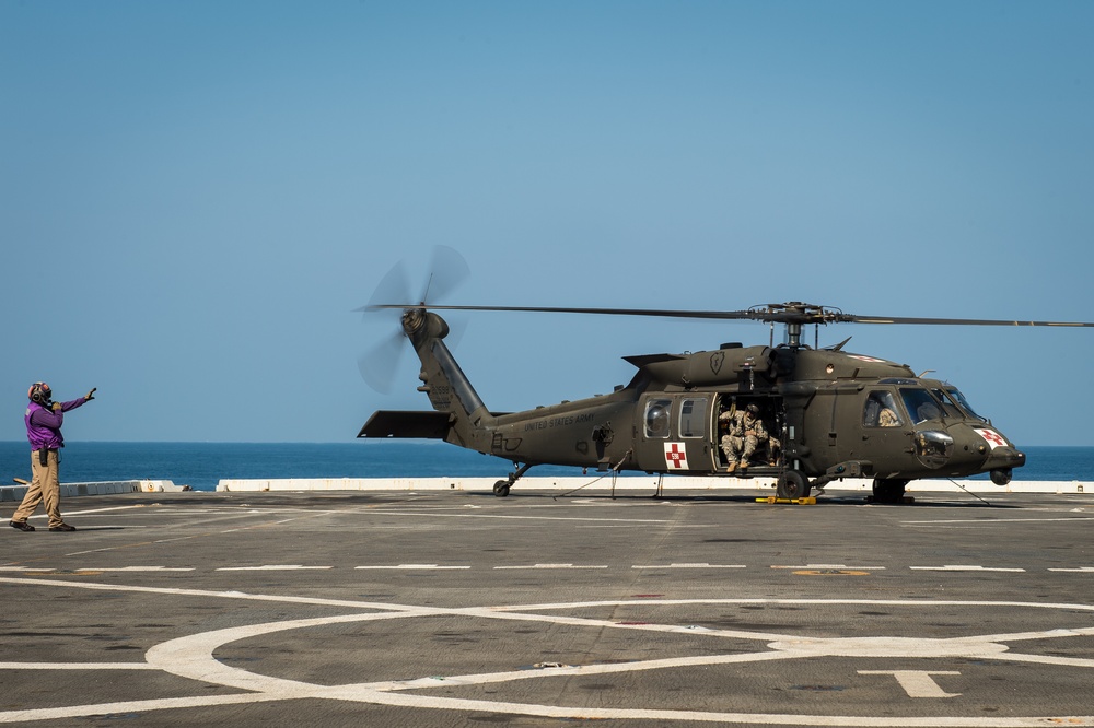 U.S. Army helicopters land on USS Greenbay