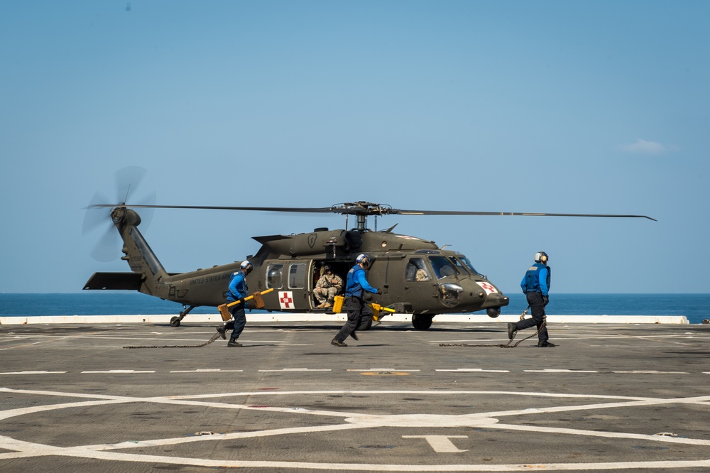 U.S. Army helicopters land on USS Greenbay