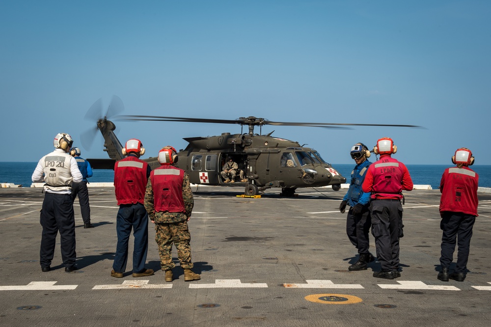 U.S. Army helicopters land on USS Greenbay