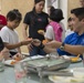 Members of the 353rd Special Operations Group help children in the Phillipines