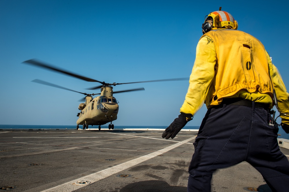 U.S. Army helicopters land on USS Greenbay