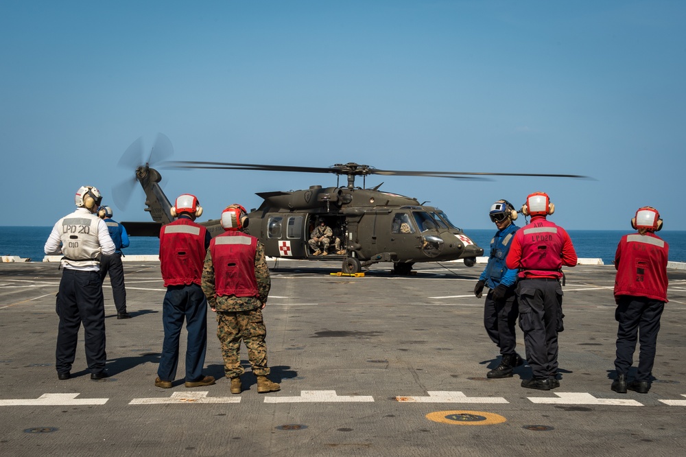 U.S. Army helicopters land on USS Greenbay