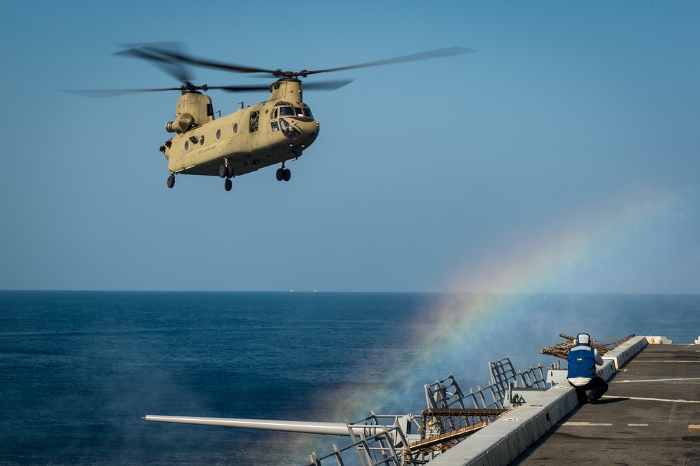 U.S. Army helicopters land on USS Greenbay