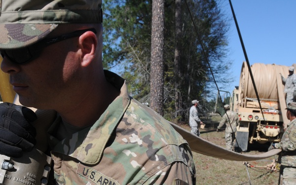 135th QM Fuelers set up Assault Hoseline System