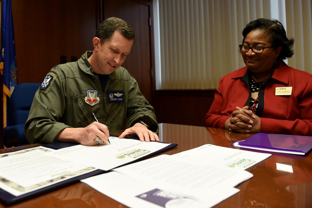 Col. Christopher Sage signs proclamation recognizing Military Saves Week