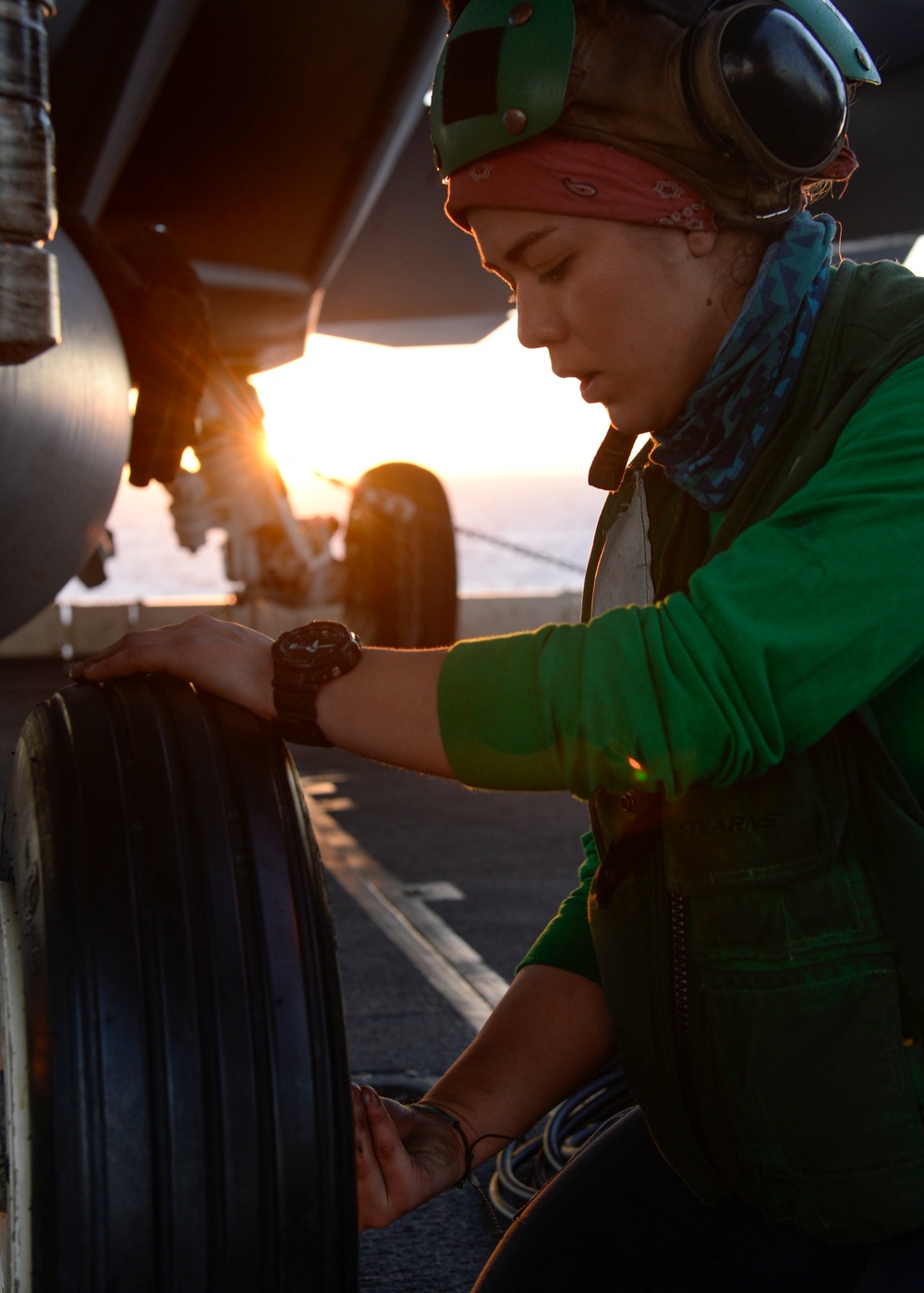 Sailor replaces aircraft tire