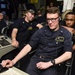 Sailors work in carrier air traffic control center