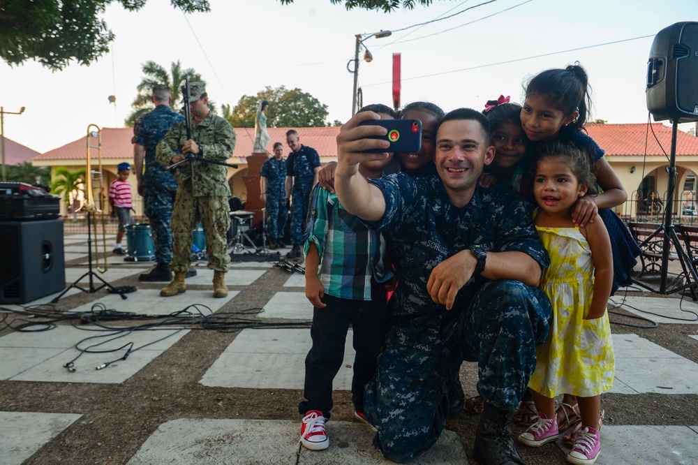 Musician 2nd Class Carl Schultz takes selfies with host nation residents after a performance in support of Continuing Promise 2017’s (CP-17)