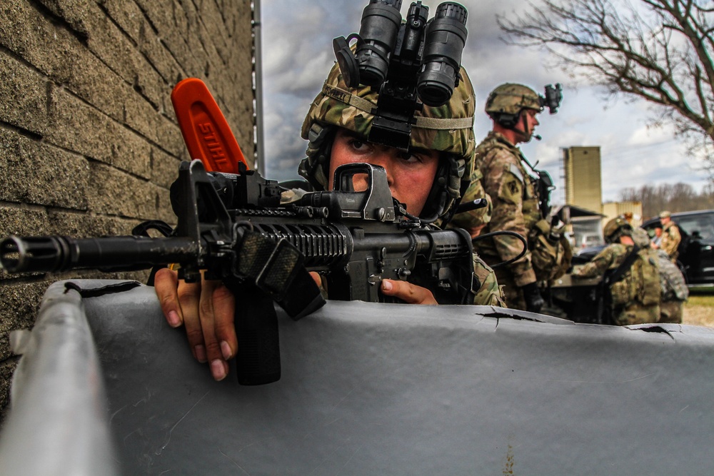 Paratrooper assumes a security position during a tactical exercise