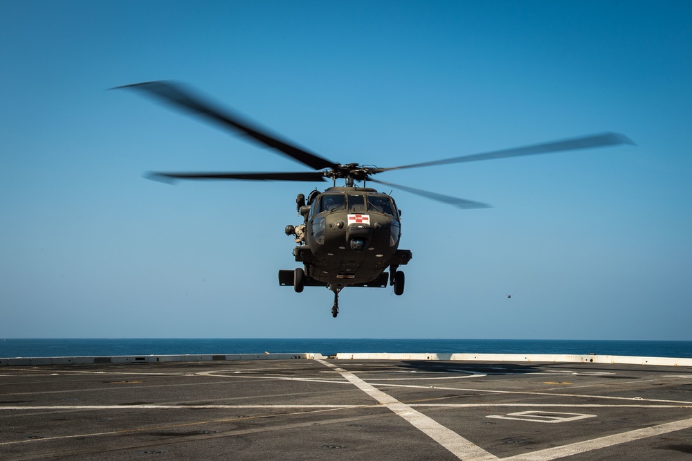 U.S. Army helicopters land on USS Greenbay