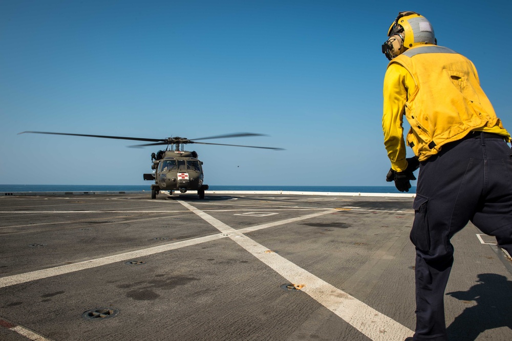 U.S. Army helicopters land on USS Greenbay