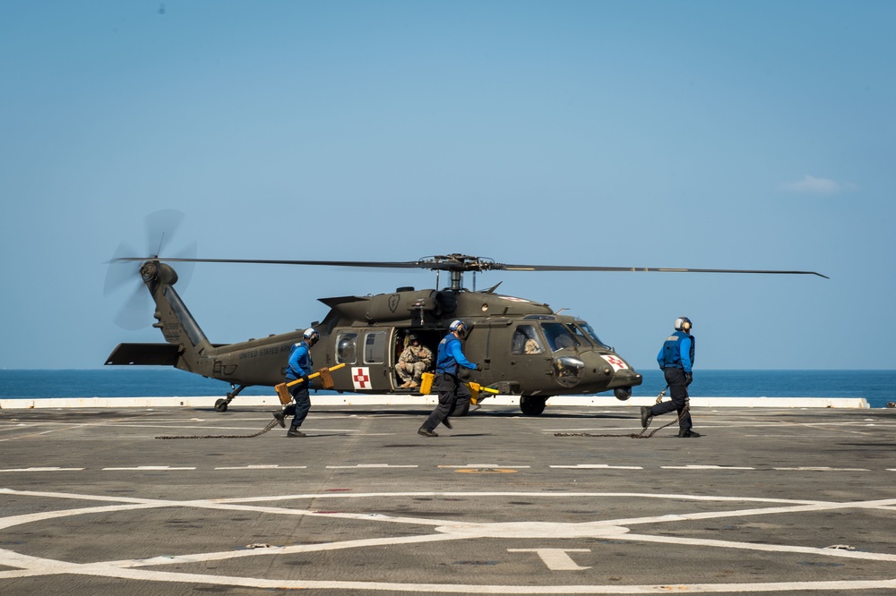 U.S. Army helicopters land on USS Greenbay