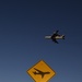 Low-flying planes sign with E-3 overhead