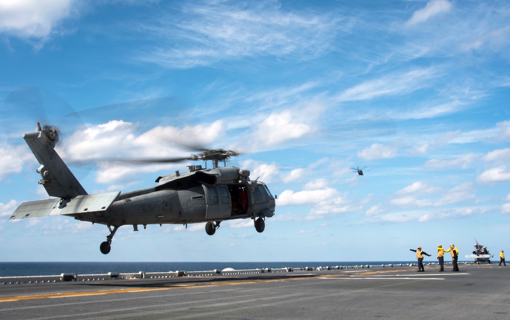 USS Bonhomme Richard (LHD 6) conducts replenishment at sea