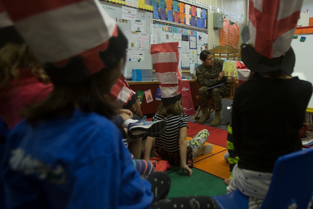 Marines read to children at Zukeren Elementary for Read Across DoDEA Day