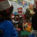 Marines read to children at Zukeren Elementary for Read Across DoDEA Day