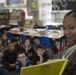 Marines read to children at Zukeren Elementary for Read Across DoDEA Day