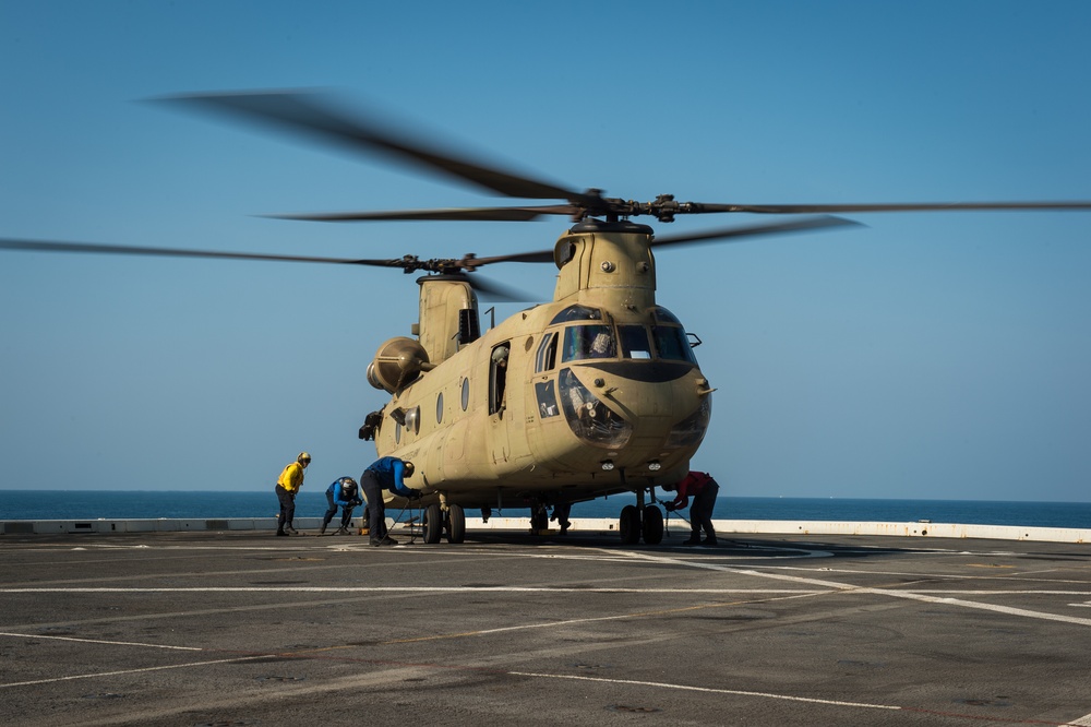 U.S. Army helicopters land on USS Greenbay