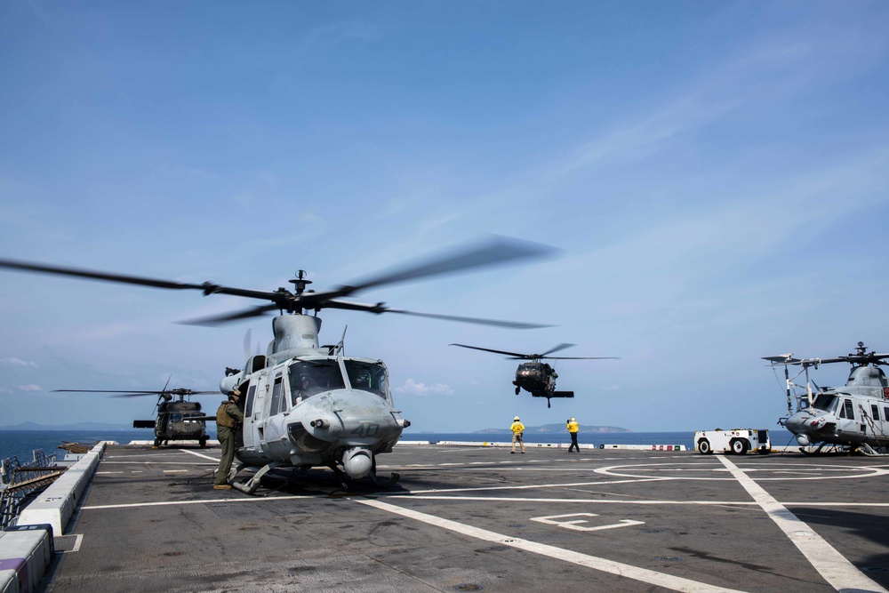 U.S. Army lands helicopters on USS Green Bay’s flight deck during Cobra Gold