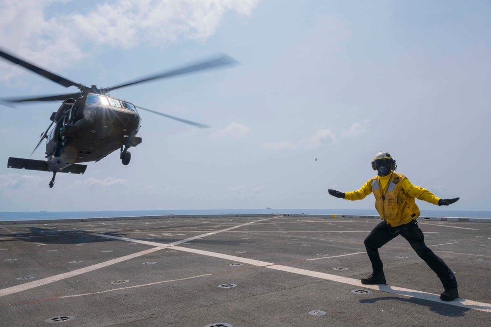 U.S. Army lands helicopters on USS Green Bay’s flight deck during Cobra Gold