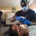 Hospitalman Billy Gibson performs a prophylaxis teeth cleaning at the Continuing Promise 2017 (CP-17) medical site