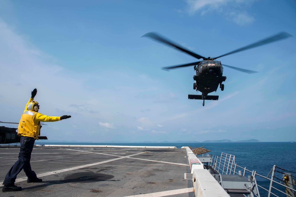 U.S. Army lands helicopters on USS Green Bay’s flight deck during Cobra Gold